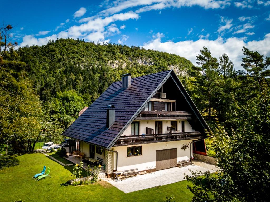 a house with solar panels on the roof at Tourist house Capricorn in Bled