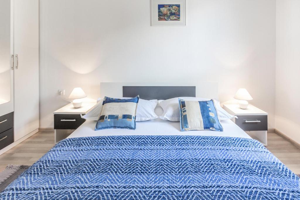 Postel nebo postele na pokoji v ubytování Apartments Perla