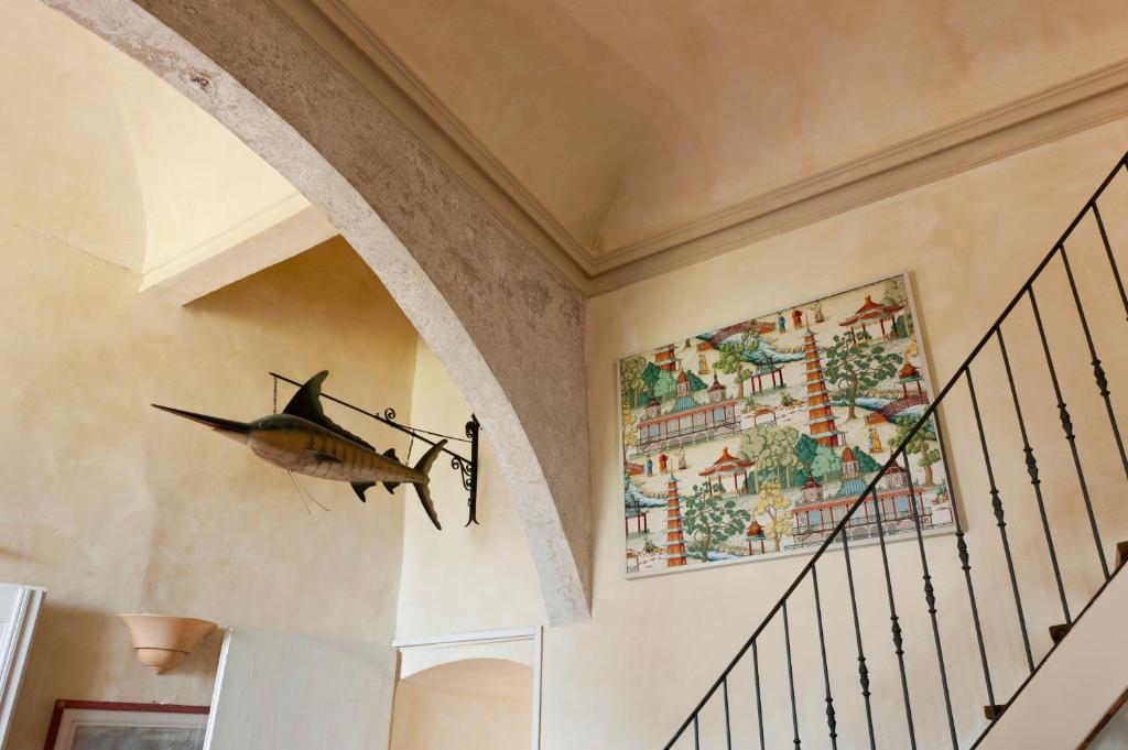 a plane hanging on the wall of a hallway at Castello di Rocca Grimalda in Rocca Grimalda