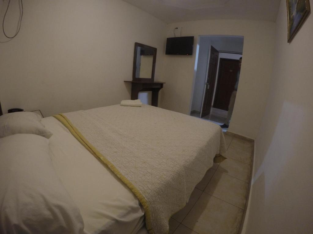 Postel nebo postele na pokoji v ubytování Backpacker Inn