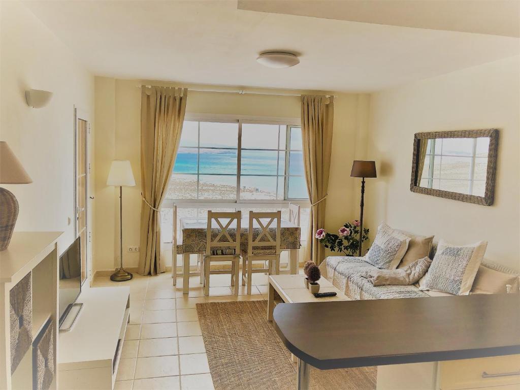 a living room with a view of the ocean at Playa Paraiso Elisabeth in Costa Calma