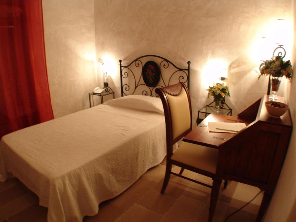 Postel nebo postele na pokoji v ubytování Hotel Masseria Fortificata Donnaloia