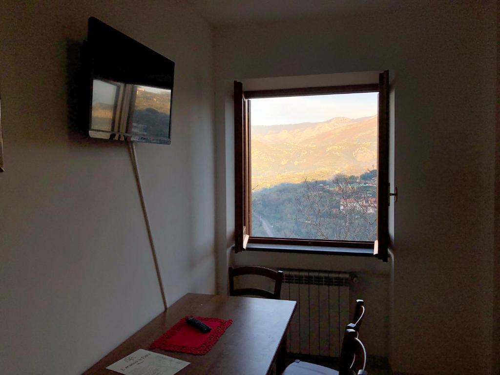 TV a/nebo společenská místnost v ubytování B&b L' Arancio in fiore