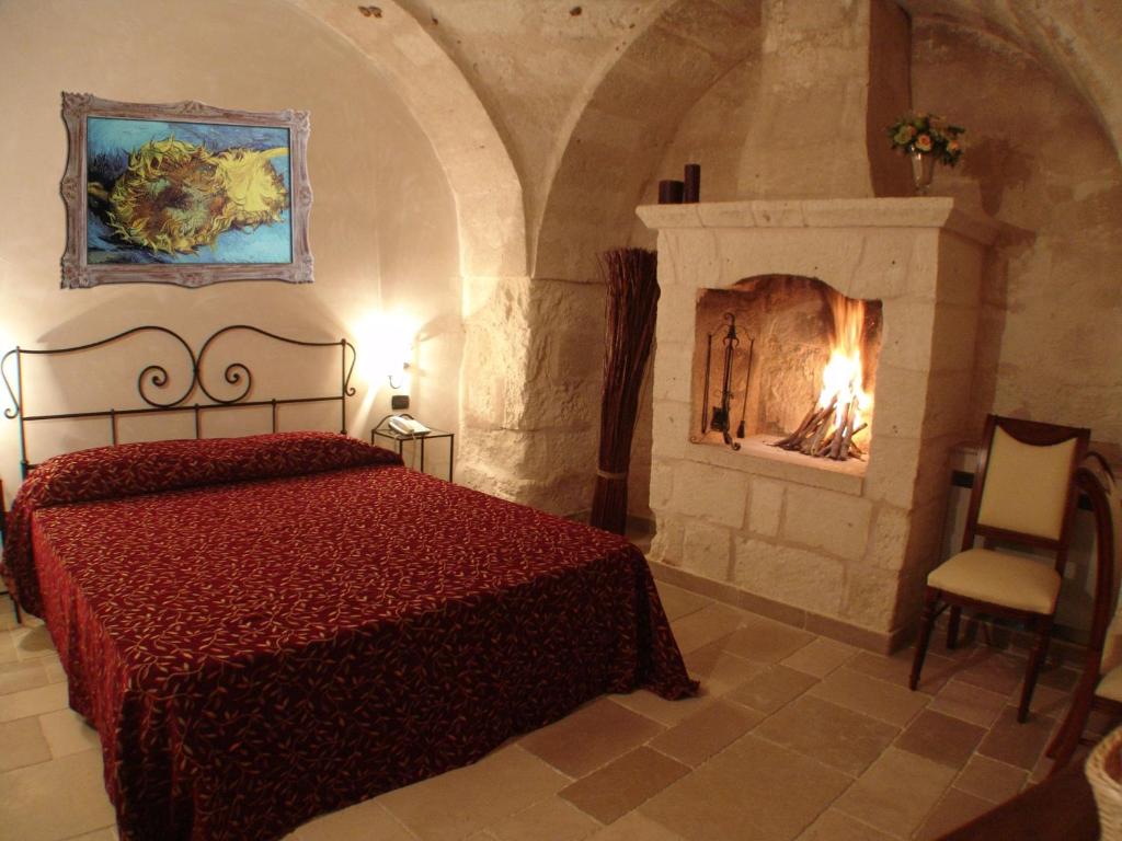 Postel nebo postele na pokoji v ubytování Hotel Masseria Fortificata Donnaloia