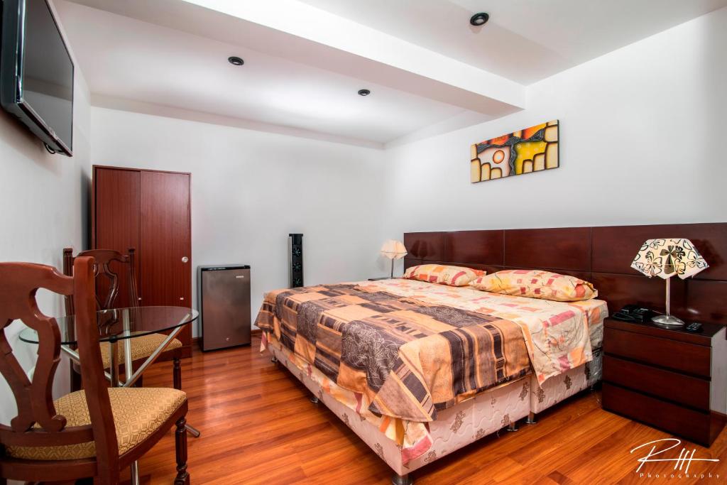 A bed or beds in a room at Hotel Costa Andina