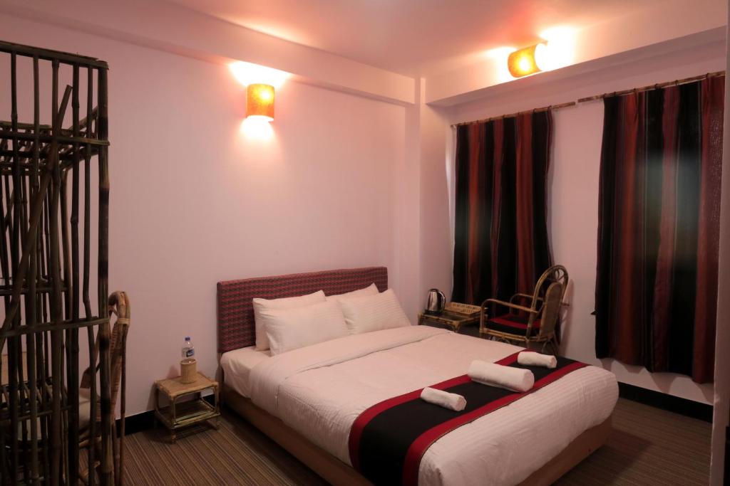 Postel nebo postele na pokoji v ubytování Easy Homes - Ashok Stupa