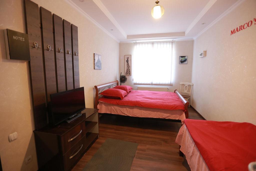 Postel nebo postele na pokoji v ubytování Marcos Hotel