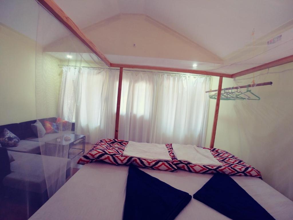 Postel nebo postele na pokoji v ubytování Sealand Beach Cottages