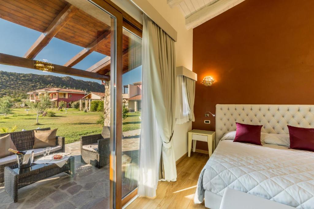 Postel nebo postele na pokoji v ubytování Hotel Sa Cheya Relais & Spa