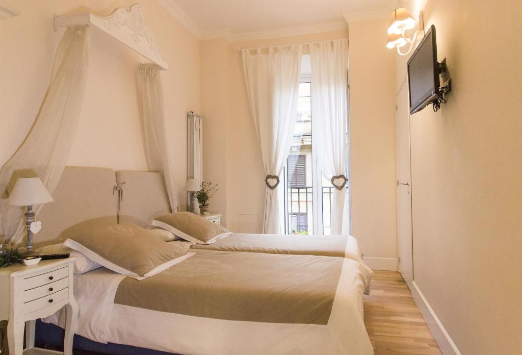 Ένα ή περισσότερα κρεβάτια σε δωμάτιο στο Trastevere Belvedere B&B