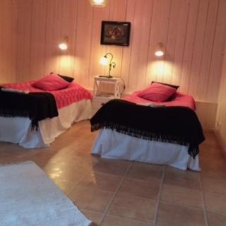 Postel nebo postele na pokoji v ubytování skummeslöv B & B