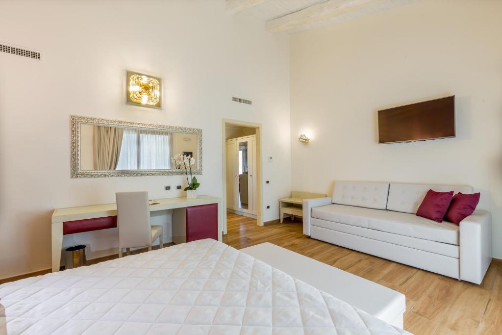 Postel nebo postele na pokoji v ubytování Hotel Sa Cheya Relais & Spa
