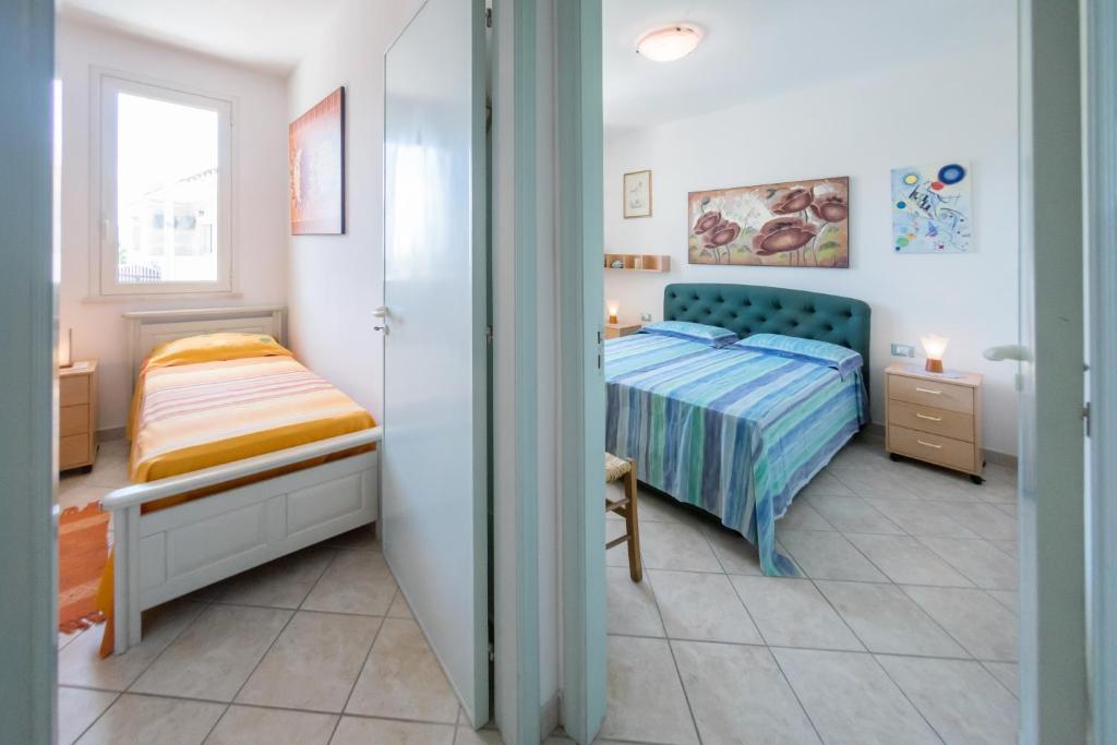 Posteľ alebo postele v izbe v ubytovaní Deliziosi Appartamenti Sul Mare