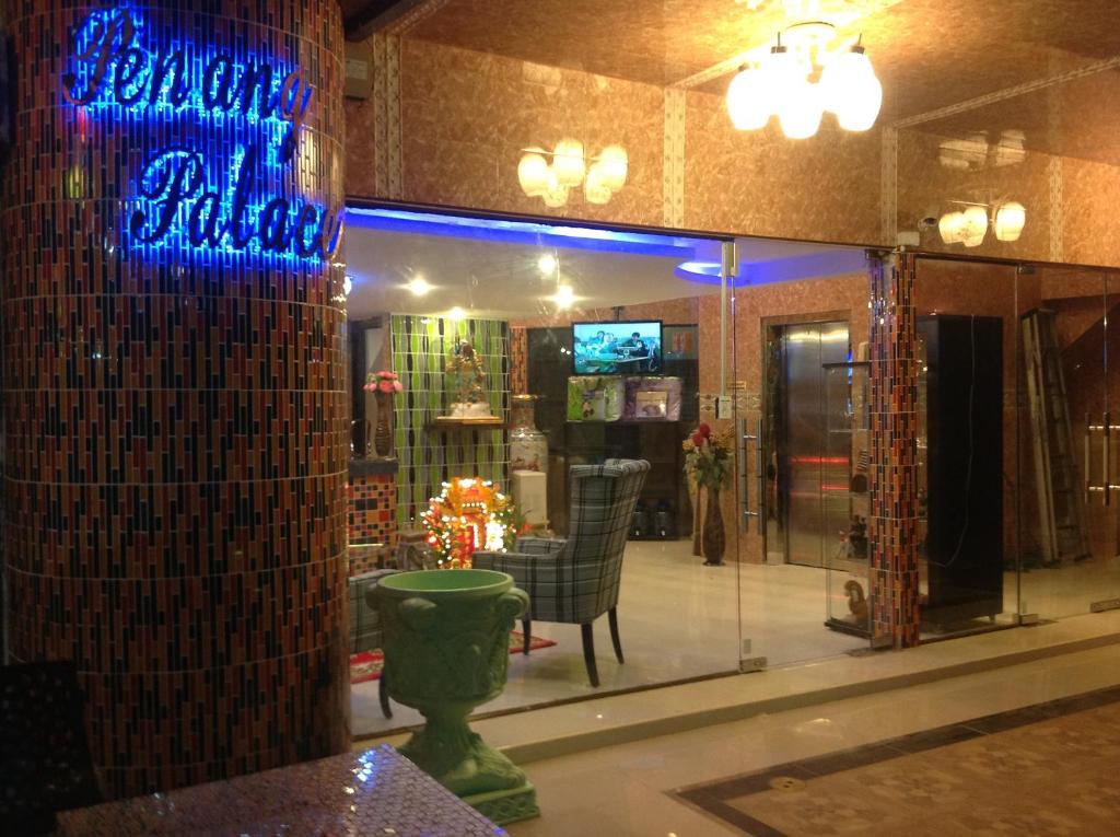 a room with a store with blue lights on the wall at Penang Palace in Bangkok