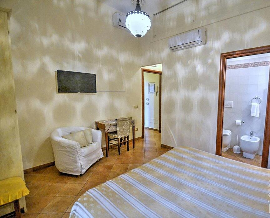 Postel nebo postele na pokoji v ubytování Divina House B&B