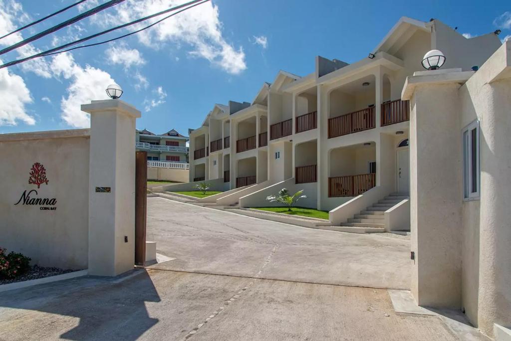a view of the front of a building at Luxury 2BR Home facing Beach w/Pool Montego Bay #3 in Montego Bay