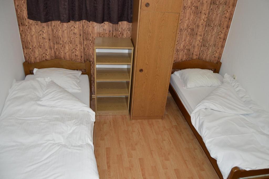 Postel nebo postele na pokoji v ubytování Pansion Modana Medjugorje