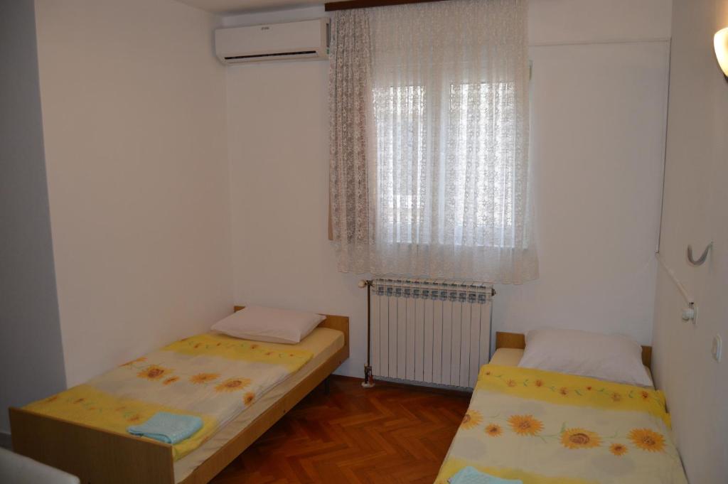 Postel nebo postele na pokoji v ubytování Pansion Modana Medjugorje