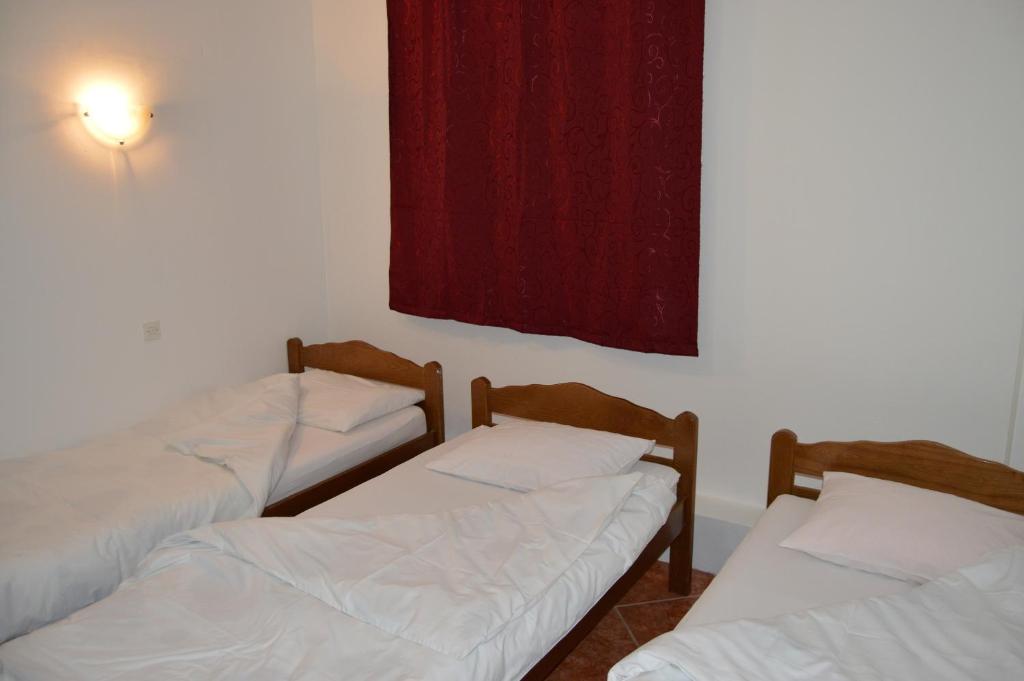 Postel nebo postele na pokoji v ubytování Pansion Modana Medjugorje