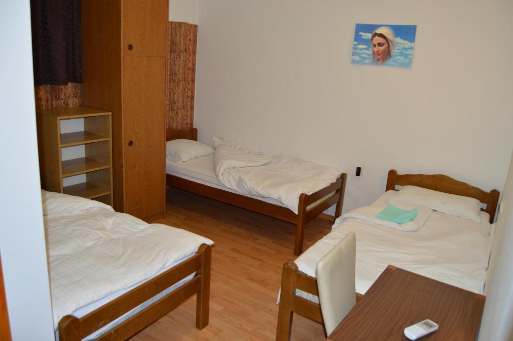 Postel nebo postele na pokoji v ubytování Pansion Modana Medjugorje