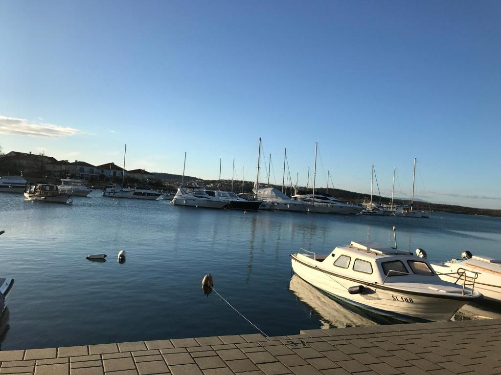 a boat is docked in a marina with other boats at Villa Sarah in Klimno
