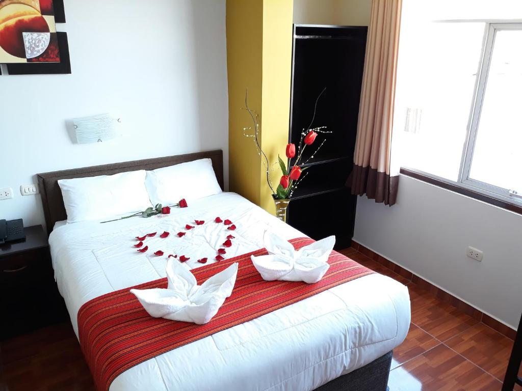 Voodi või voodid majutusasutuse Pumas Cusco Hotel toas