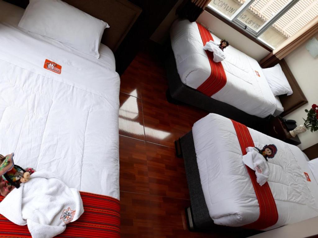 Voodi või voodid majutusasutuse Pumas Cusco Hotel toas
