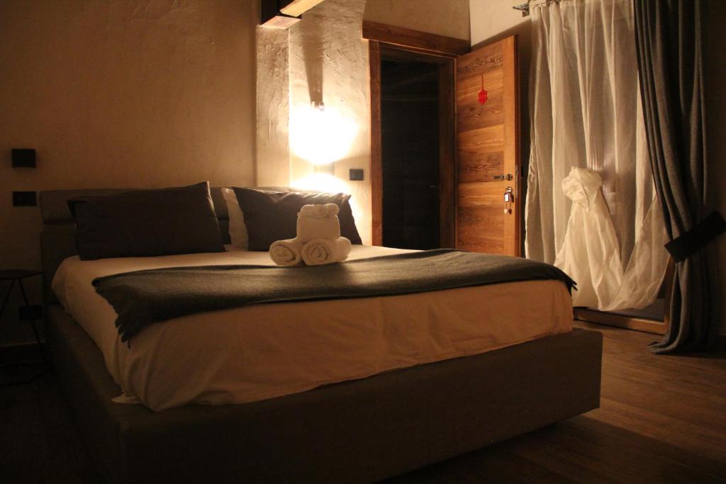 Postel nebo postele na pokoji v ubytování B&B Lo Matsòn