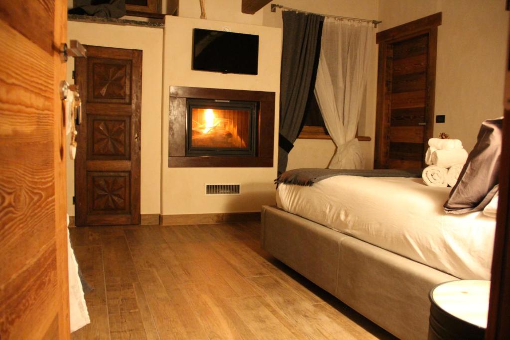 Postel nebo postele na pokoji v ubytování B&B Lo Matsòn