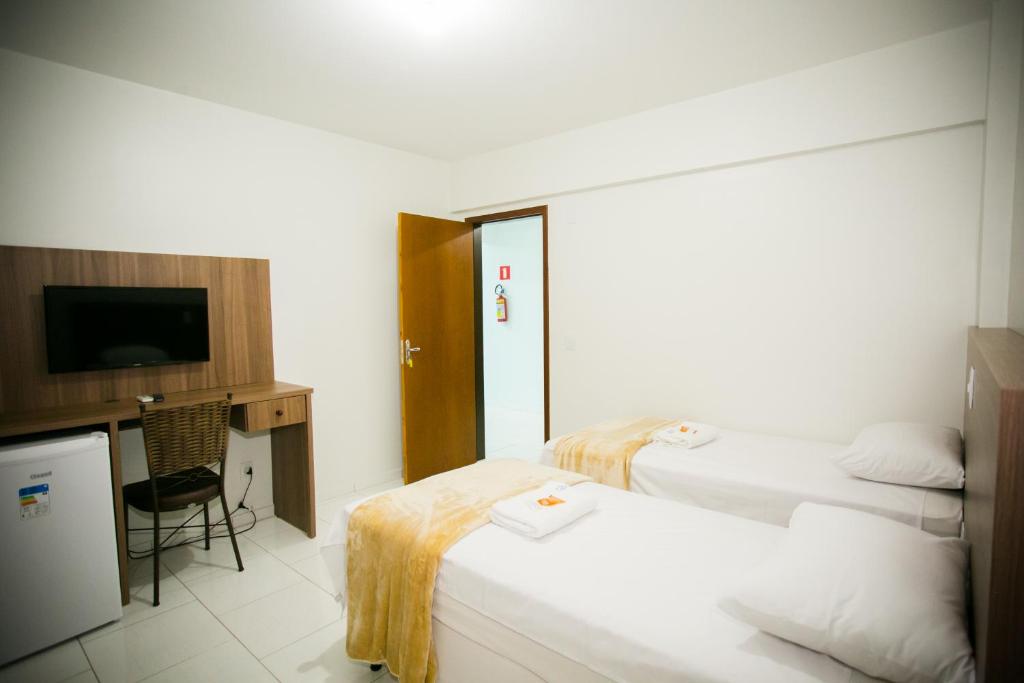 Postel nebo postele na pokoji v ubytování Hotel Folley