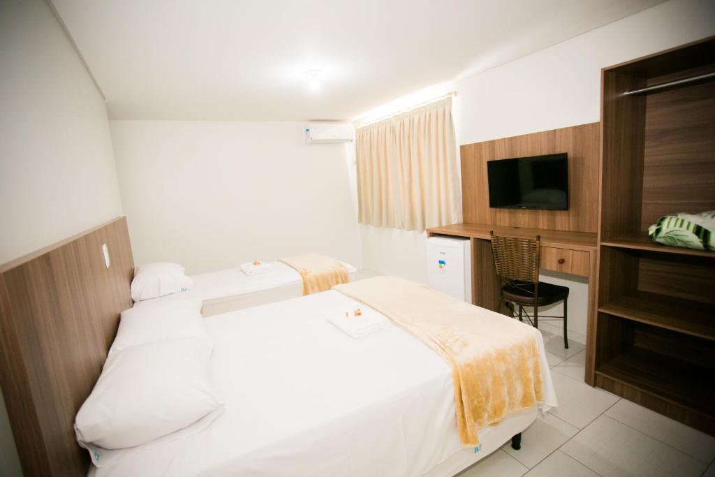 Postel nebo postele na pokoji v ubytování Hotel Folley