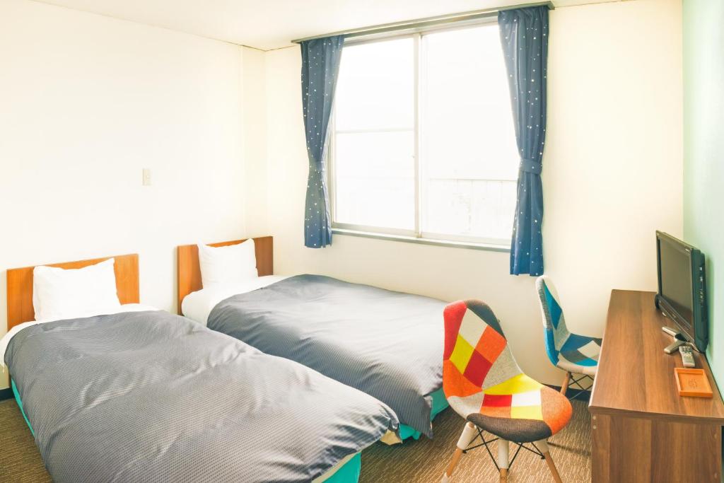 Postel nebo postele na pokoji v ubytování Hotel Ina