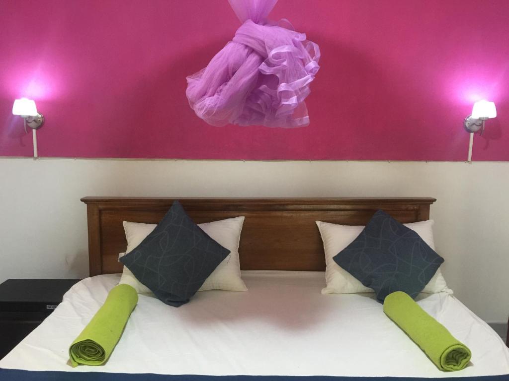 Postel nebo postele na pokoji v ubytování orchid villa