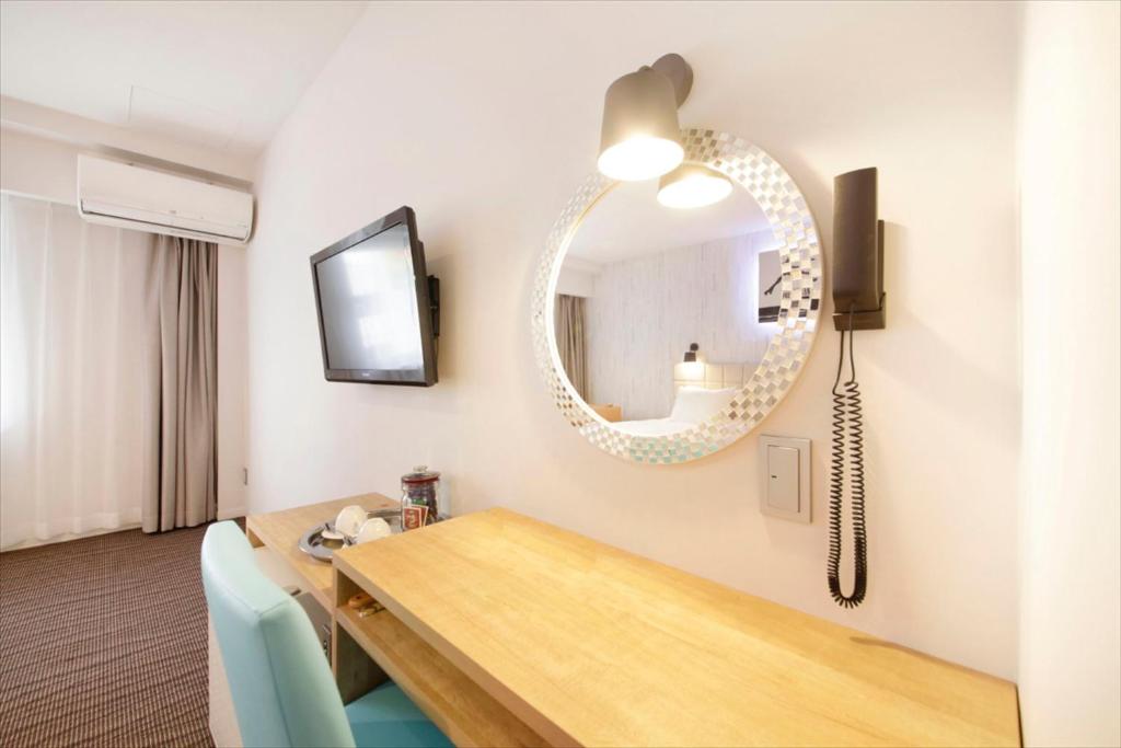 TV a/nebo společenská místnost v ubytování Hotel Plumm