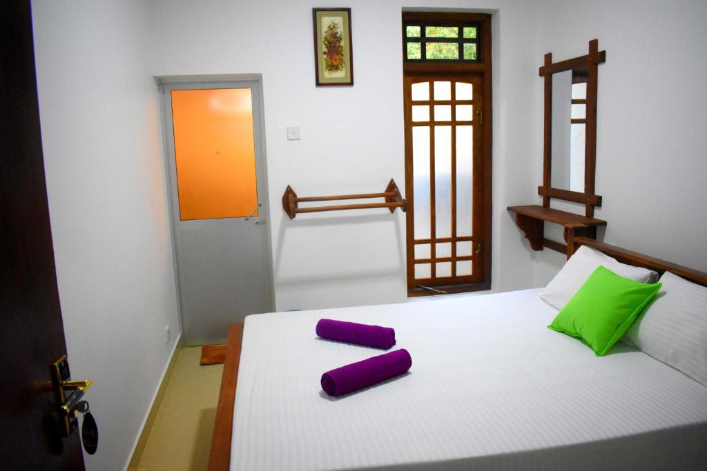 Postel nebo postele na pokoji v ubytování Leonine Villa Yala