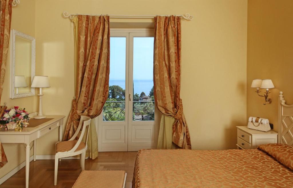 Postel nebo postele na pokoji v ubytování Villa Sofia Hotel