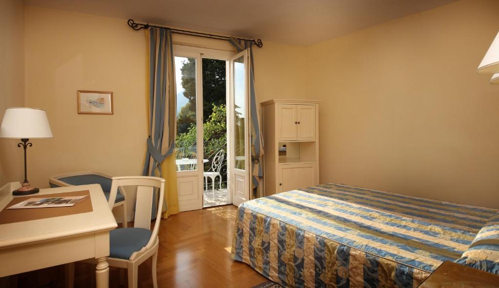 Postel nebo postele na pokoji v ubytování Villa Sofia Hotel