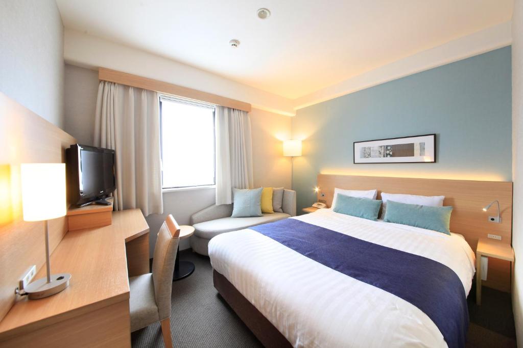 Postel nebo postele na pokoji v ubytování Shonandai Daiichi Hotel Fujisawa Yokohama