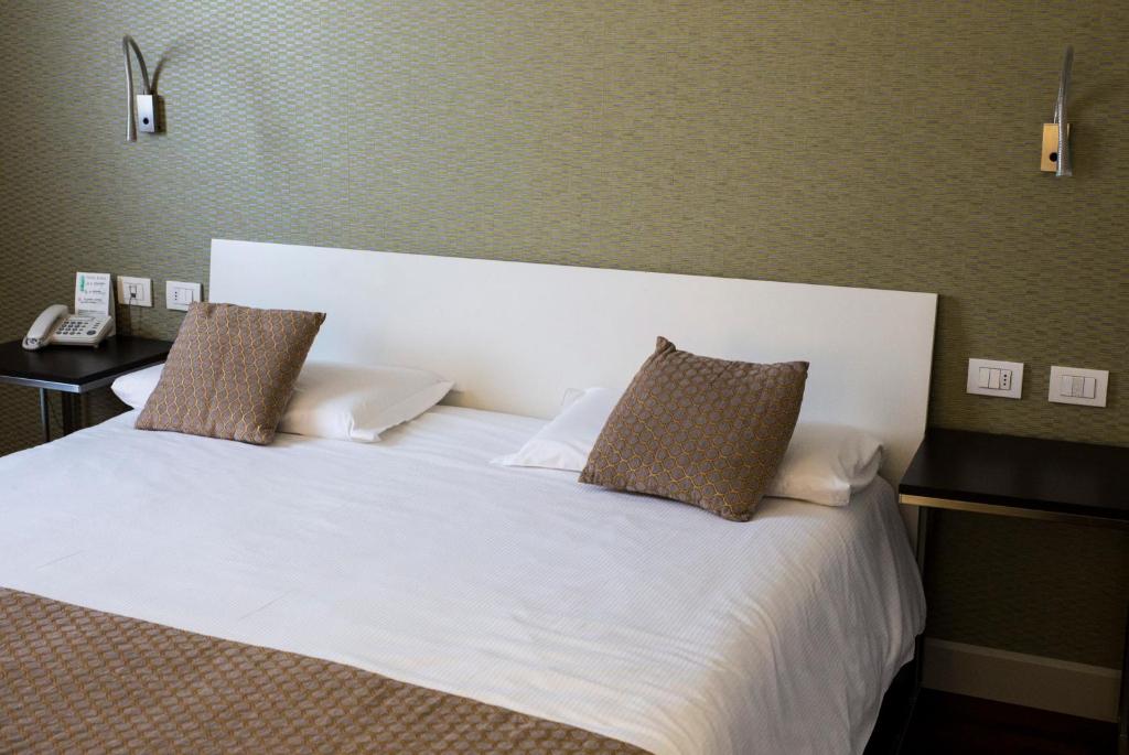 Posteľ alebo postele v izbe v ubytovaní Hotel Datini