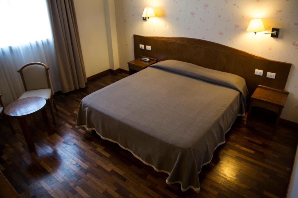 Posteľ alebo postele v izbe v ubytovaní Hotel Datini