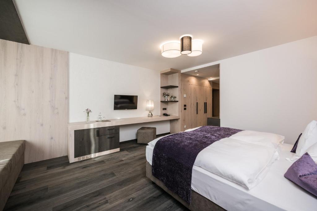 Postel nebo postele na pokoji v ubytování Alpinhotel Keil