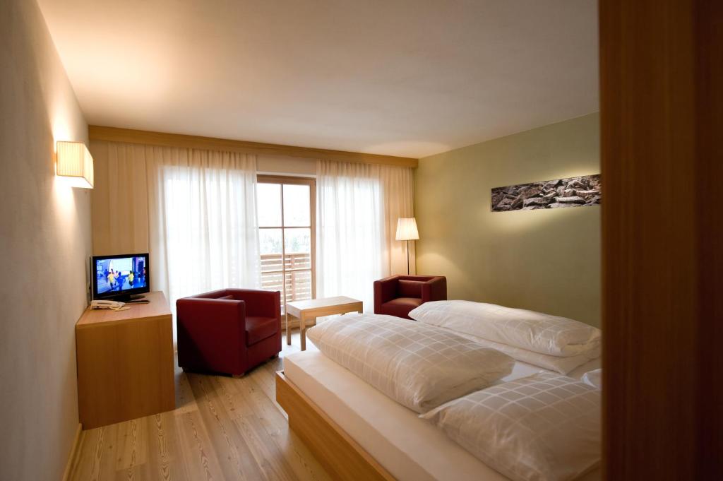 Postel nebo postele na pokoji v ubytování Hotel Ostaria Posta