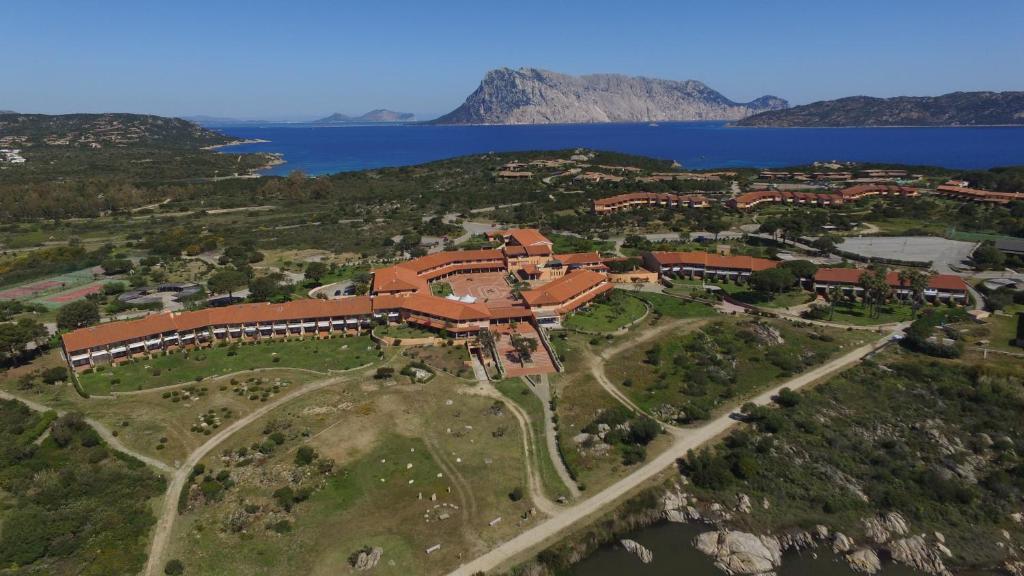an aerial view of a resort near the water at Residence Porto Coda Cavallo in San Teodoro