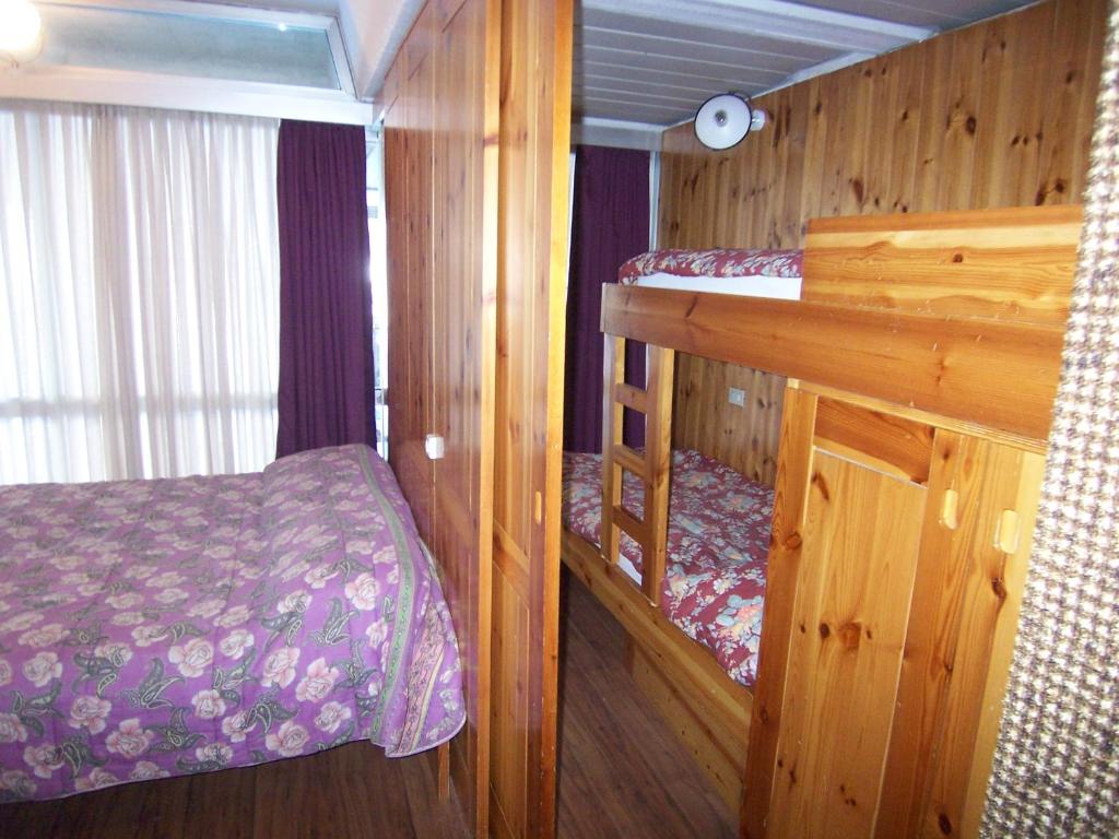 Postel nebo postele na pokoji v ubytování Res. Marilleva 1400 Apt.Solandra