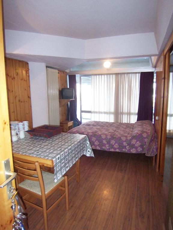 Postel nebo postele na pokoji v ubytování Res. Marilleva 1400 Apt.Solandra