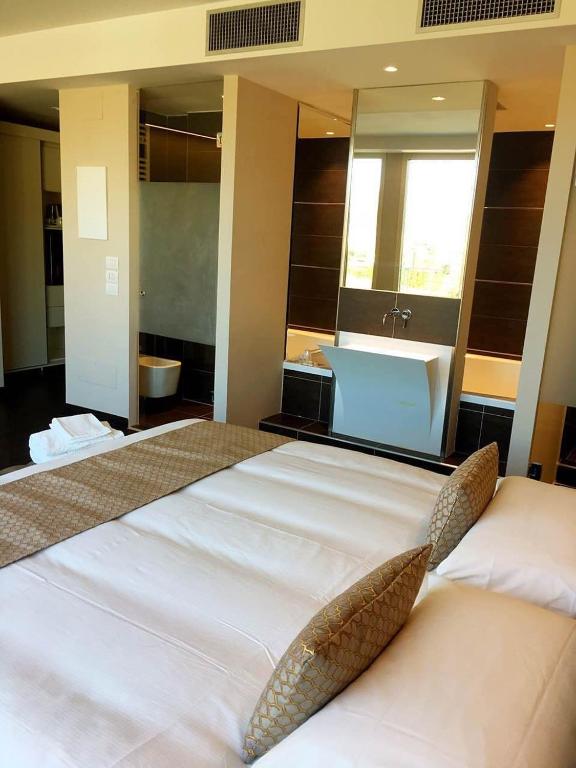 Posteľ alebo postele v izbe v ubytovaní Hotel Datini