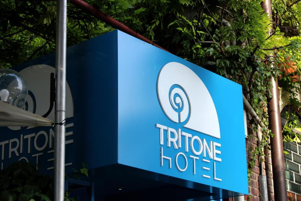 a sign for a future hotel at Hotel Tritone in Trieste