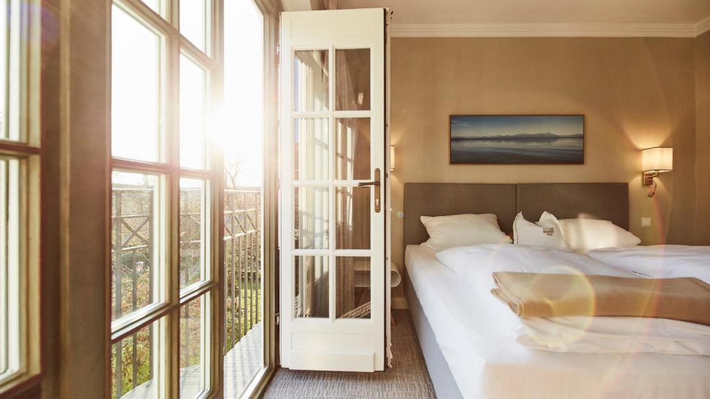 Postel nebo postele na pokoji v ubytování Hotel Gutsgasthof Stangl