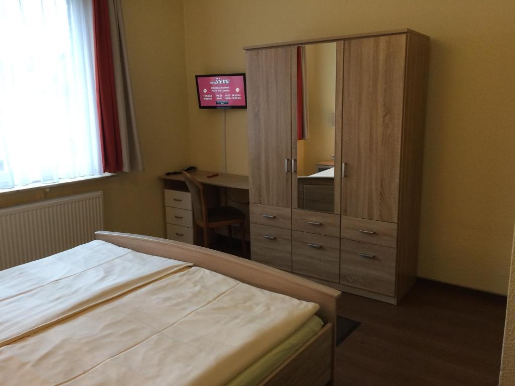 Postel nebo postele na pokoji v ubytování Hotel Sieme