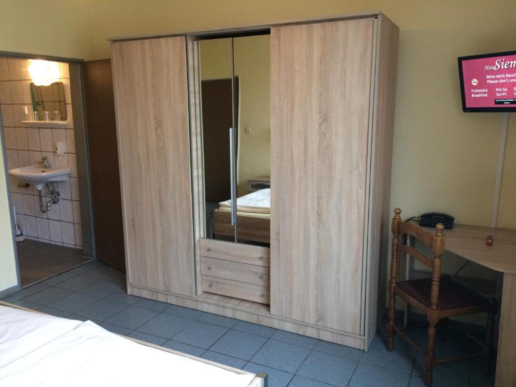 Postel nebo postele na pokoji v ubytování Hotel Sieme